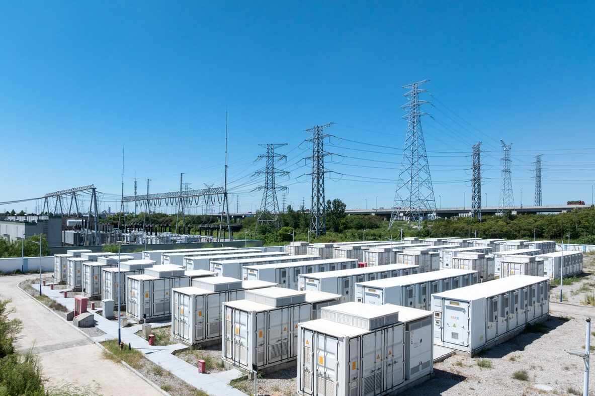 Aerial view of battery energy storage systems under a clear blue sky
