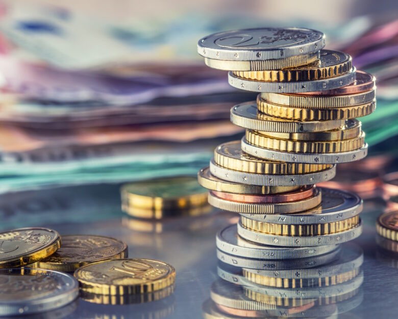Money. Euro coins. Euro money. Euro currency.Coins stacked on each other in different positions. Money concept.