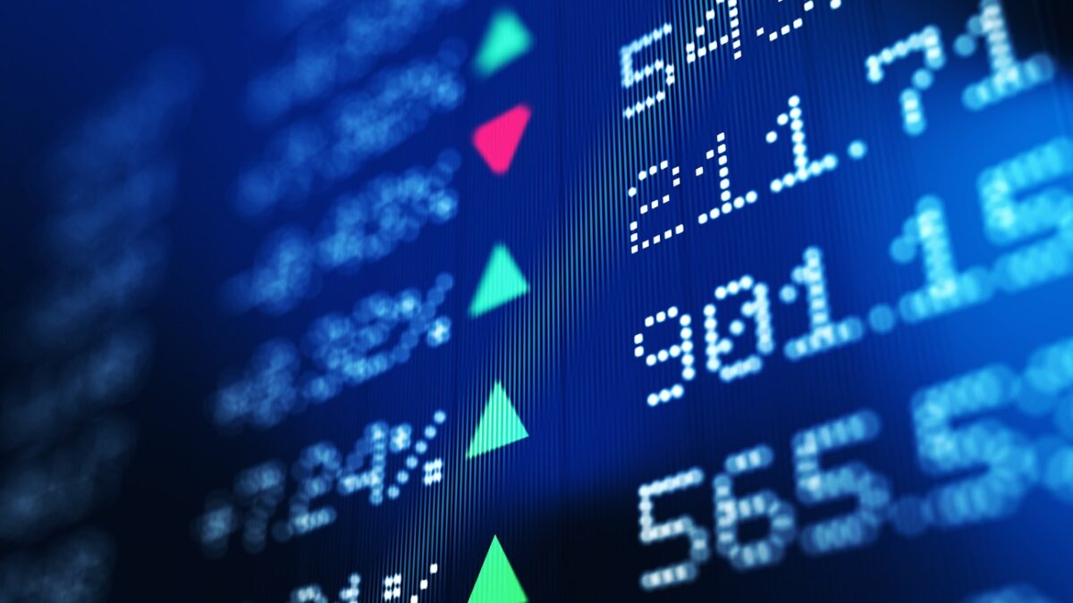 Financial data analysis graph showing stock market trends on a trading board. Horizontal composition with copy space and selective focus