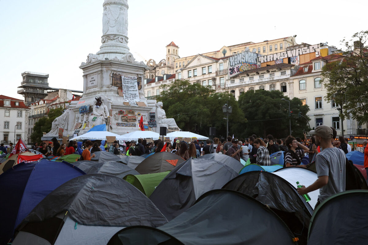 People at a protest camp Rossio square against house crisis and cost of living, in Lisbon, Portugal, October 19, 2026. REUTERS