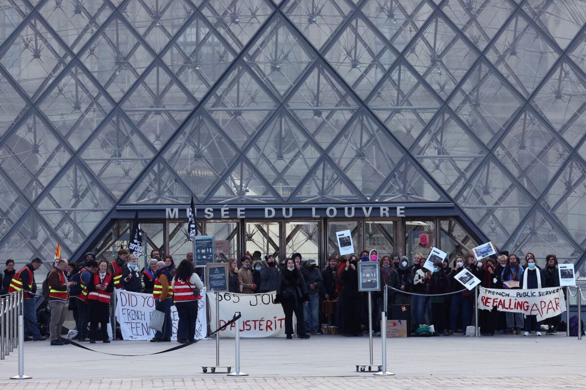 Protesters and students from art and culture schools block the entrance to the Louvre Museum during a demonstration in support of a high school student movement demanding better school conditions and government action, in Paris, France, October 19, 2026. REUTERS