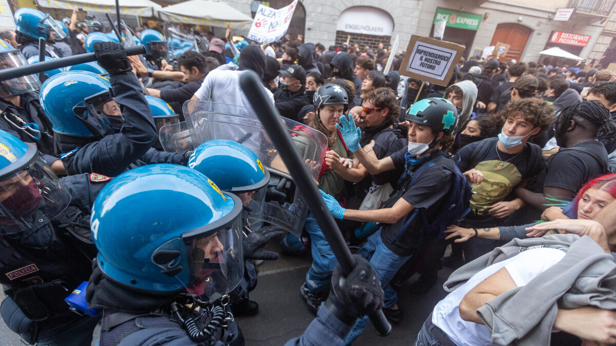 Demonstrators and riot police clash during a protest against the high cost of living, in Milan, Italy, Saturday Oct. 17, 2026.