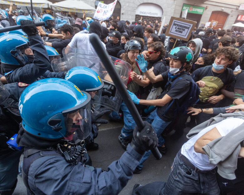 Demonstrators and riot police clash during a protest against the high cost of living, in Milan, Italy, Saturday Oct. 17, 2026.
