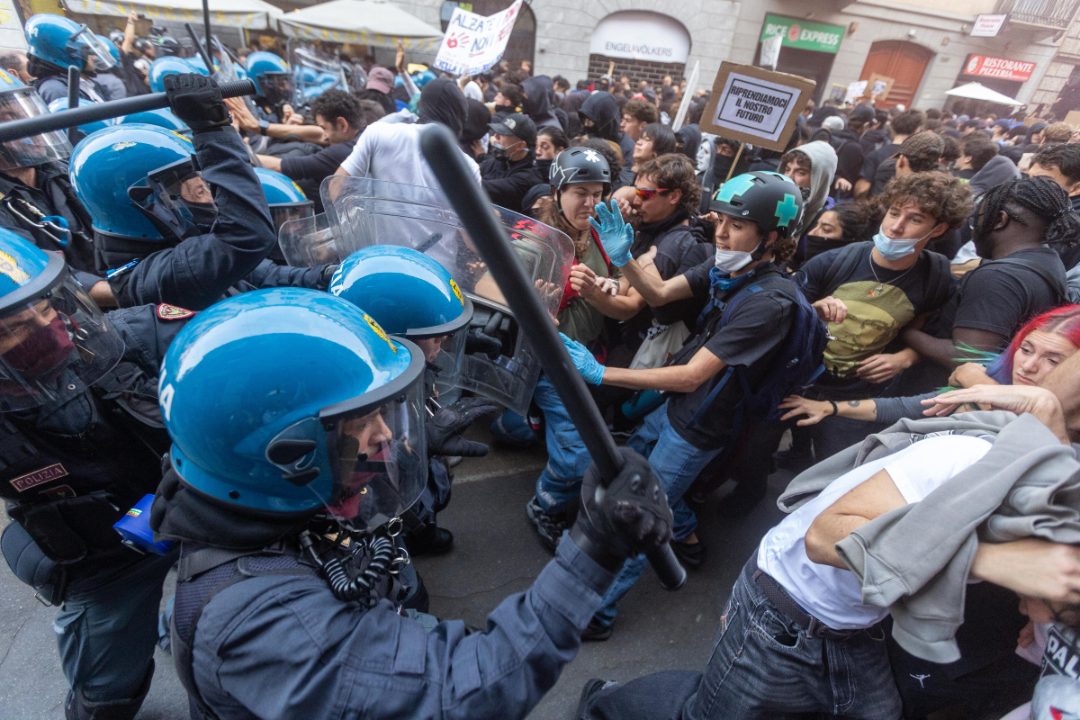 Demonstrators and riot police clash during a protest against the high cost of living, in Milan, Italy, Saturday Oct. 17, 2026.