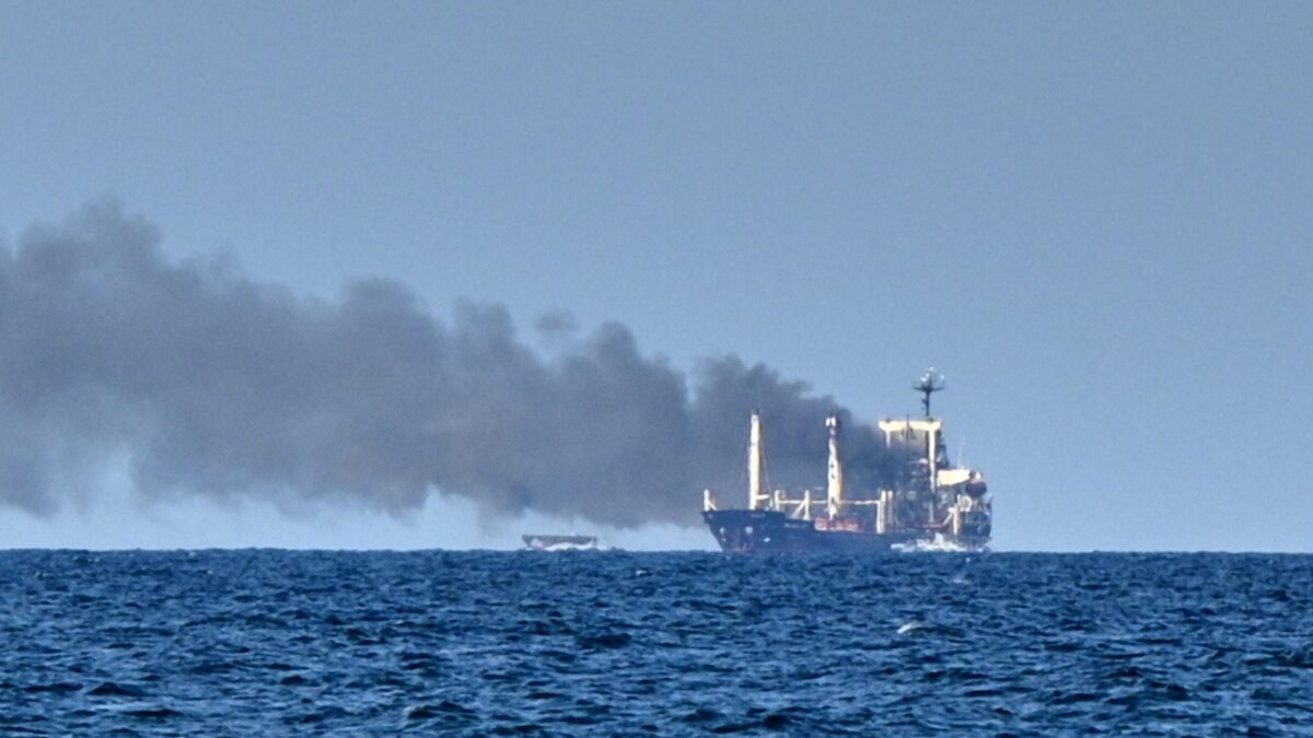 Smoke rises from the grain carrier Golden Leo under the Guinea-Bissau flag after Russian missile strike in the Black Sea close to Odesa, Ukraine, Sunday, July 19, 2026, local media reports.
