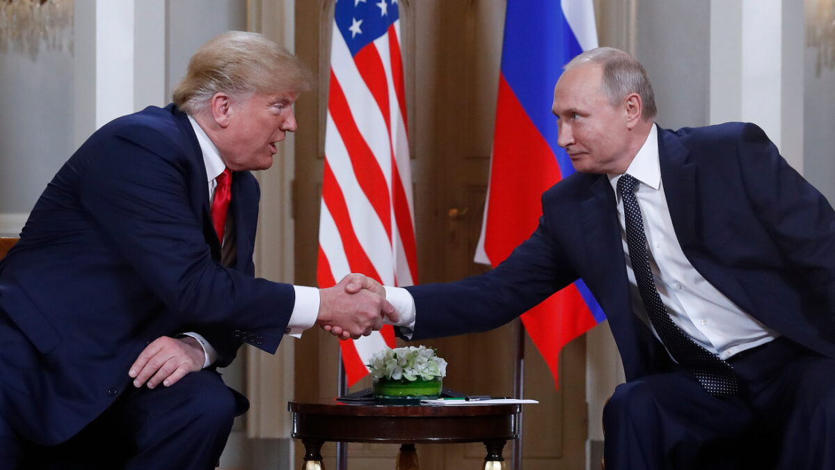 FILE - U.S. President Donald Trump, left, and Russian President Vladimir Putin, right, shake hands at the beginning of a meeting at the Presidential Palace in Helsinki, Finland, July 16, 2018.