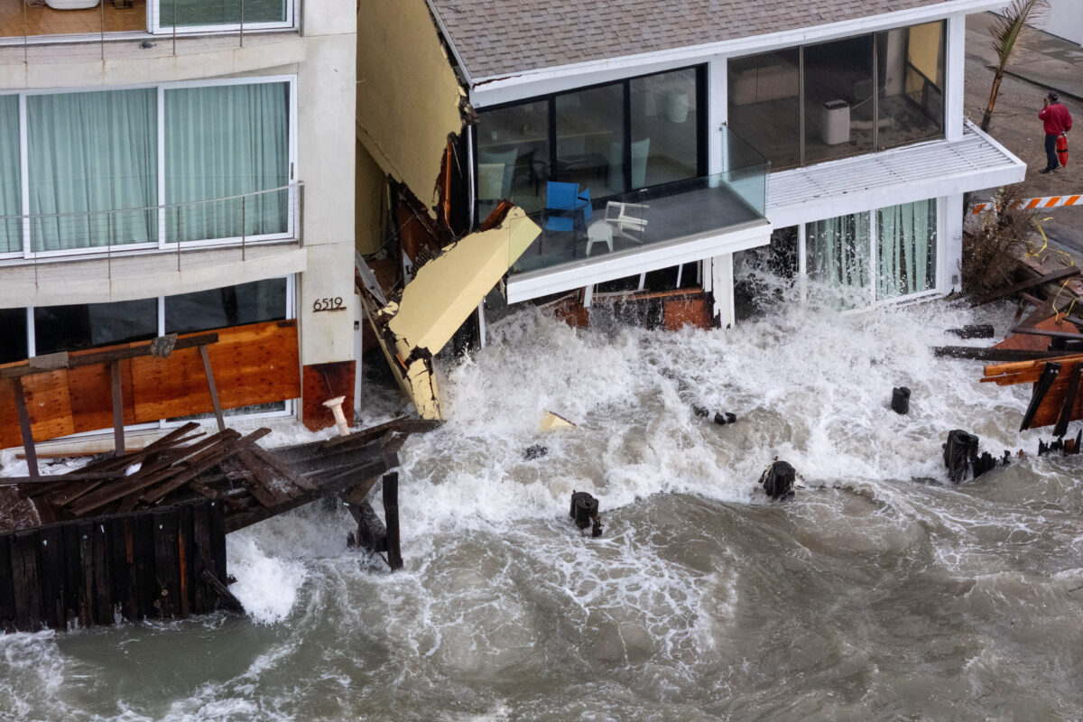 A drone view shows waves generated by Post-Tropical Cyclone Rachel as they impact houses along the coastline in Long Beach, California, US, October 11, 2026. REUTERS