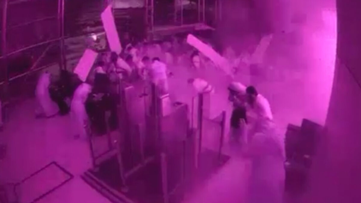 This image from CCTV video released by Saudi Arabia's Media Ministry shows passengers taking cover as flames and smoke fill part of King Khalid International Airport in Riyadh, Saudi Arabia, during what authorities described as a strike at the airport on Saturday, Oct. 10, 2026.