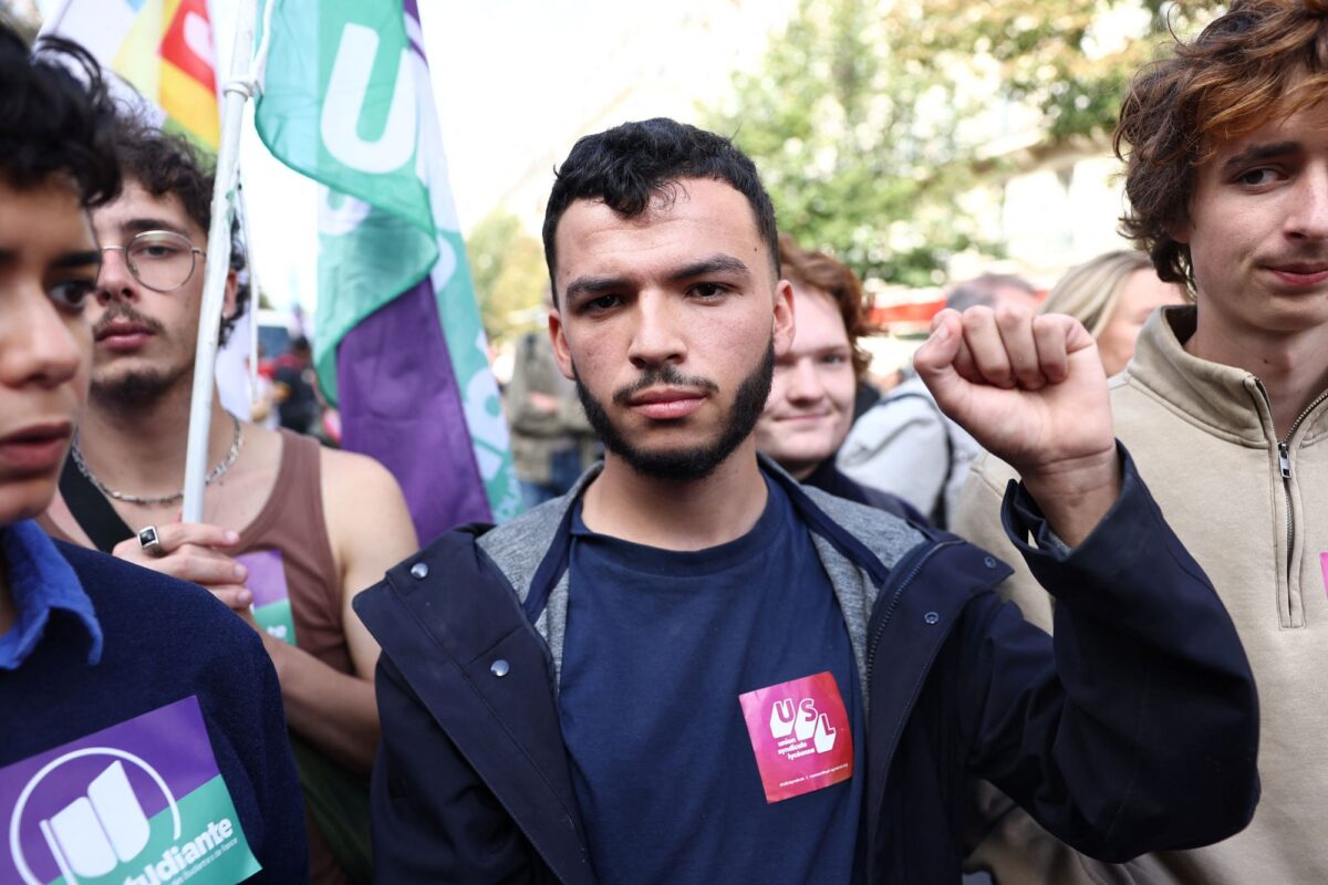 Ryad Rani, president of the Union Syndicale Lyceenne (USL - High School Student Union) raises his fist during a demonstration by high school and university students, supported by teachers' union and school parents, in Paris as part of a nationwide day of protests and blockades, voicing anger over overcrowded classrooms, teacher shortages and dilapidated school buildings, which students blame on years of underinvestment, France, October 6, 2026. REUTERS