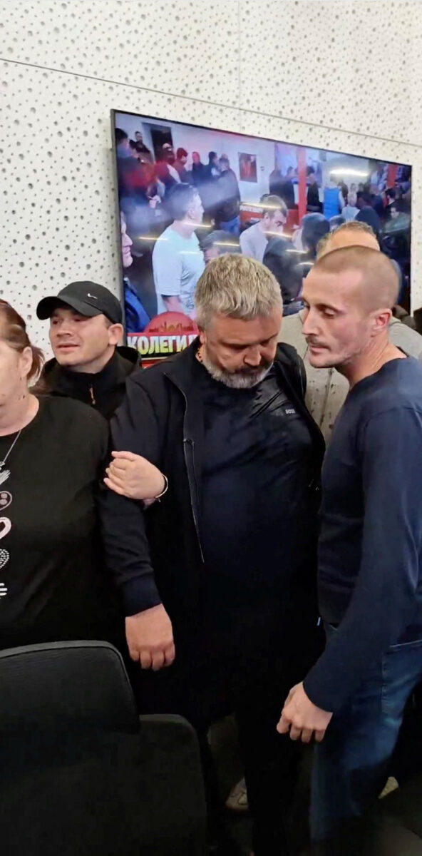 Protestors confront editor of Informer TV, Dragan Vucicevic, in media's Belgrade office, Serbia, October 26, 2026 in this screengrab obtained from a social media video published on TikTok @veljars