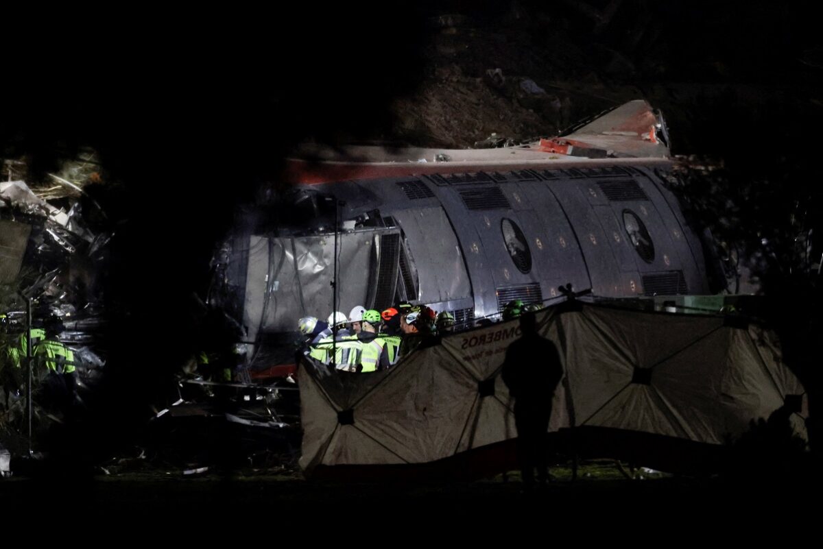 Rescue personnel work at the site of the collision of two high-speed trains between the towns of Mora and Orgaz, near Toledo, Spain, October 28, 2026. REUTERS