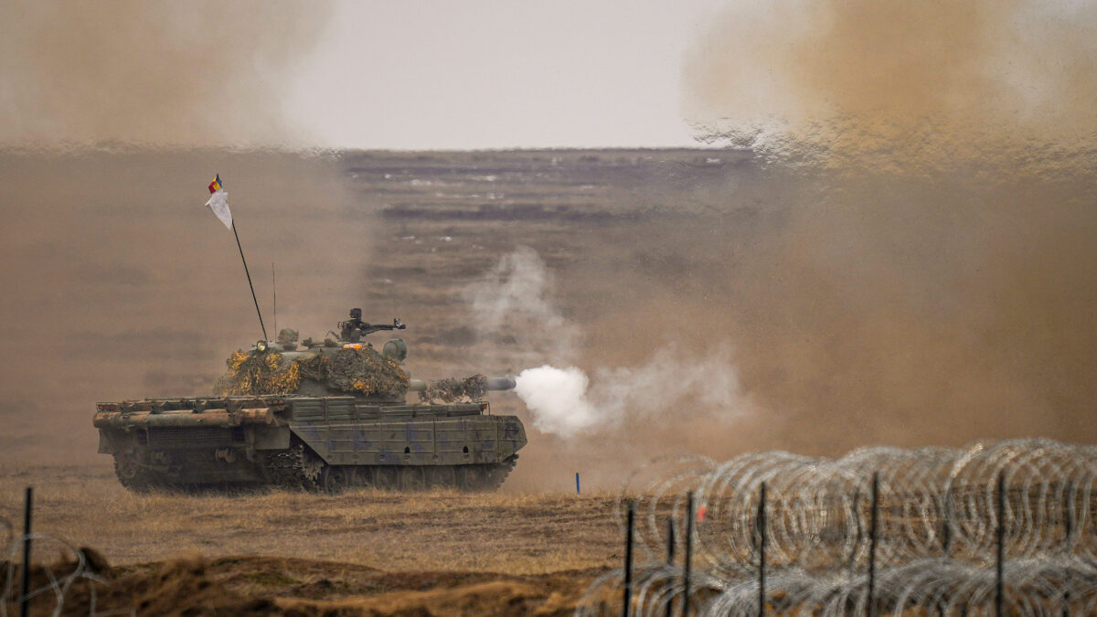 FILE - A tank fires during the Steadfast Dart 2025 exercise, involving multiple nations and representing one of the largest NATO operations planned this year, at a training range in Smardan, eastern Romania, Feb. 19, 2025.