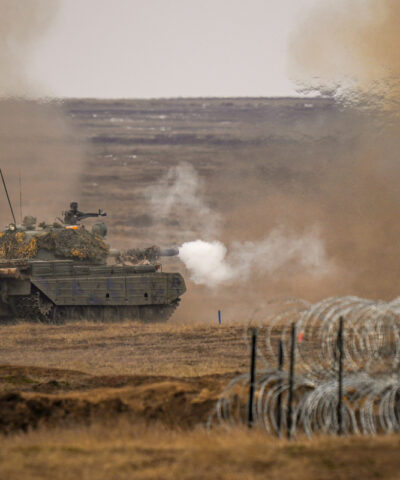 FILE - A tank fires during the Steadfast Dart 2025 exercise, involving multiple nations and representing one of the largest NATO operations planned this year, at a training range in Smardan, eastern Romania, Feb. 19, 2025.