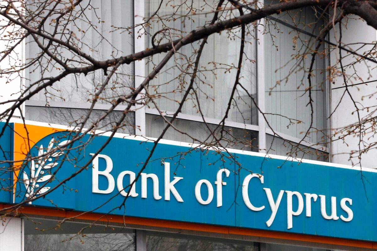 The logo of Bank of Cyprus is seen in Bucharest March 25, 2013. Cyprus clinched a last-ditch deal with international lenders to shut down its second largest bank and inflict heavy losses on uninsured depositors, including wealthy Russians, in return for a 10 billion euro ($13 billion) bailout