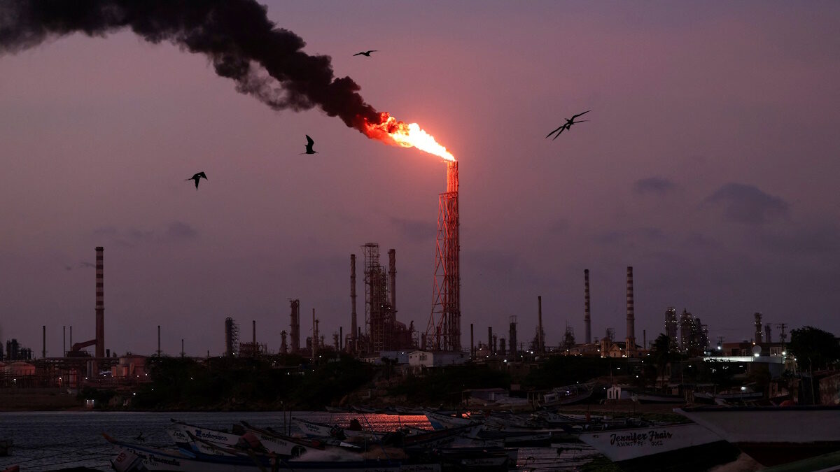 FILE PHOTO: A gas flare burns at the Cardon refinery, part of the Paraguana Refining Center, as years of underinvestment, equipment failures and shortages have hampered fuel production in Venezuela, in Punta Cardon, Venezuela, May 6, 2026.